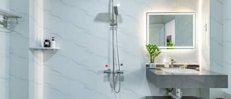 Shower, hair dryer, towels, soap