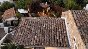 A stone building with a tiled roof, surrounded by greenery and other buildings. - THE STONE DIMORA - Madonie Suite & Garden SPA-Exclusive Villa & Private Park  (Blufi)
