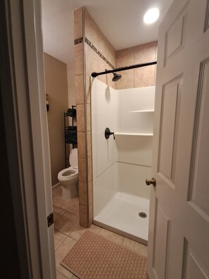 Shower, hair dryer, towels, toilet paper