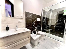 Classic Double Room, Balcony, Partial Sea View | Bathroom | Shower, free toiletries, hair dryer, towels