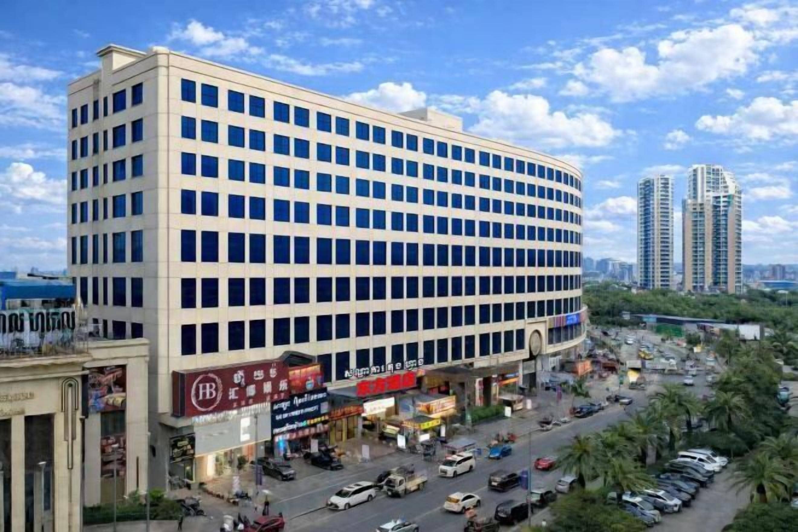 A multi-story commercial building with a flat facade and numerous windows.