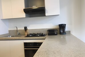 Apartamento | Cocina privada | Trona infantil