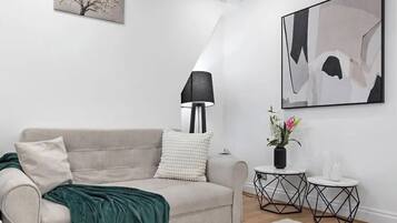 Apartamento luxo, vista para a cidade | Área de estar