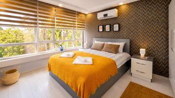 Family Condo, 2 Bedrooms, Kitchen, City View | Desk, laptop workspace, blackout drapes, soundproofing