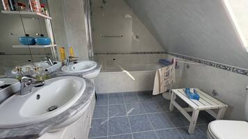 Shower, hair dryer, towels, toilet paper