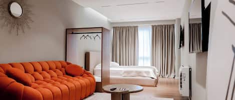 Deluxe Suite | Living area | 40-cm Smart TV with digital channels