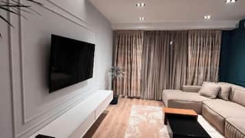 Deluxe Apartment | Living area | 40-cm Smart TV with digital channels