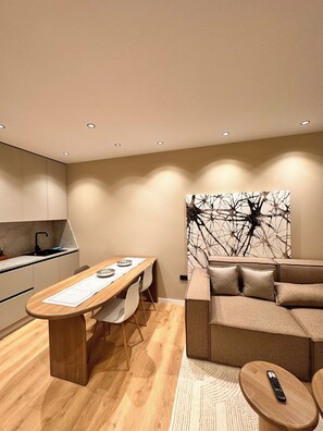 Deluxe Apartment | Living area | 40-cm Smart TV with digital channels