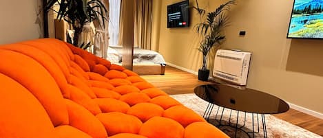 Deluxe Suite | Living area | 40-cm Smart TV with digital channels