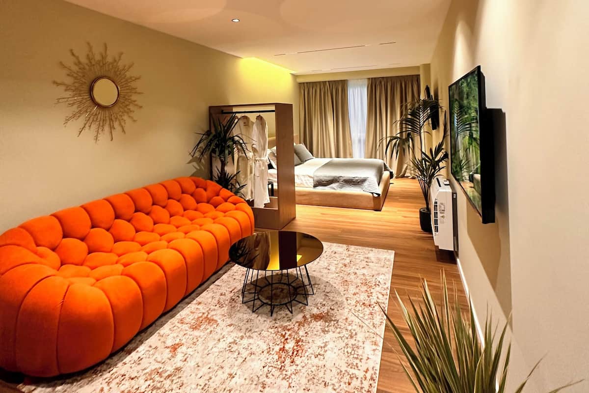 Deluxe Suite | Living area | 40-cm Smart TV with digital channels