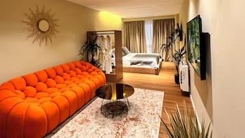 Deluxe Suite | Living area | 40-cm Smart TV with digital channels