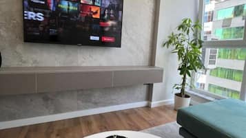 Deluxe Apartment | Living area | 40-cm Smart TV with digital channels