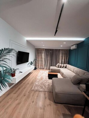 Deluxe Apartment | Living area | 40-cm Smart TV with digital channels