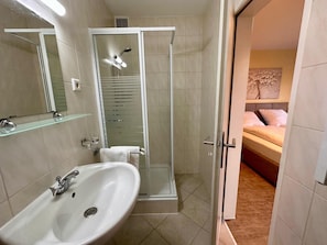Basic Double Room, Courtyard View | Bathroom | Hair dryer, towels, soap, shampoo