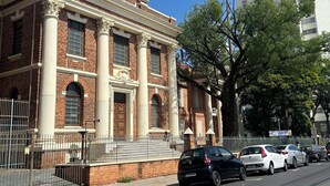 A historic building with classical architecture, including columns and a symmetrical facade. - AP Smart Hub Agro (Piracicaba)
