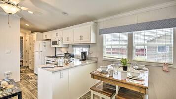 Fridge, microwave, electric kettle, dining table