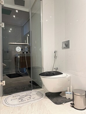 Shower, jetted bath, hair dryer, bidet