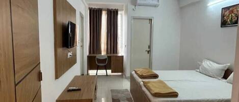 Habitación Deluxe doble, balcón | Zona de estar