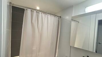 Shower, towels, soap, toilet paper