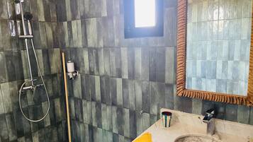 Shower, towels, soap, toilet paper