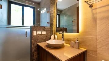 Shower, towels, soap, toilet paper