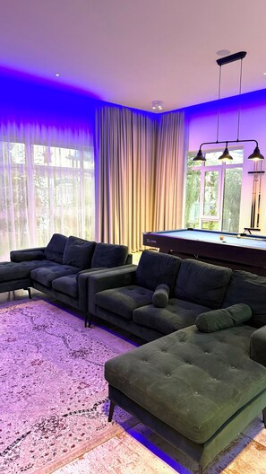 Smart TV, fireplace, table football, music library