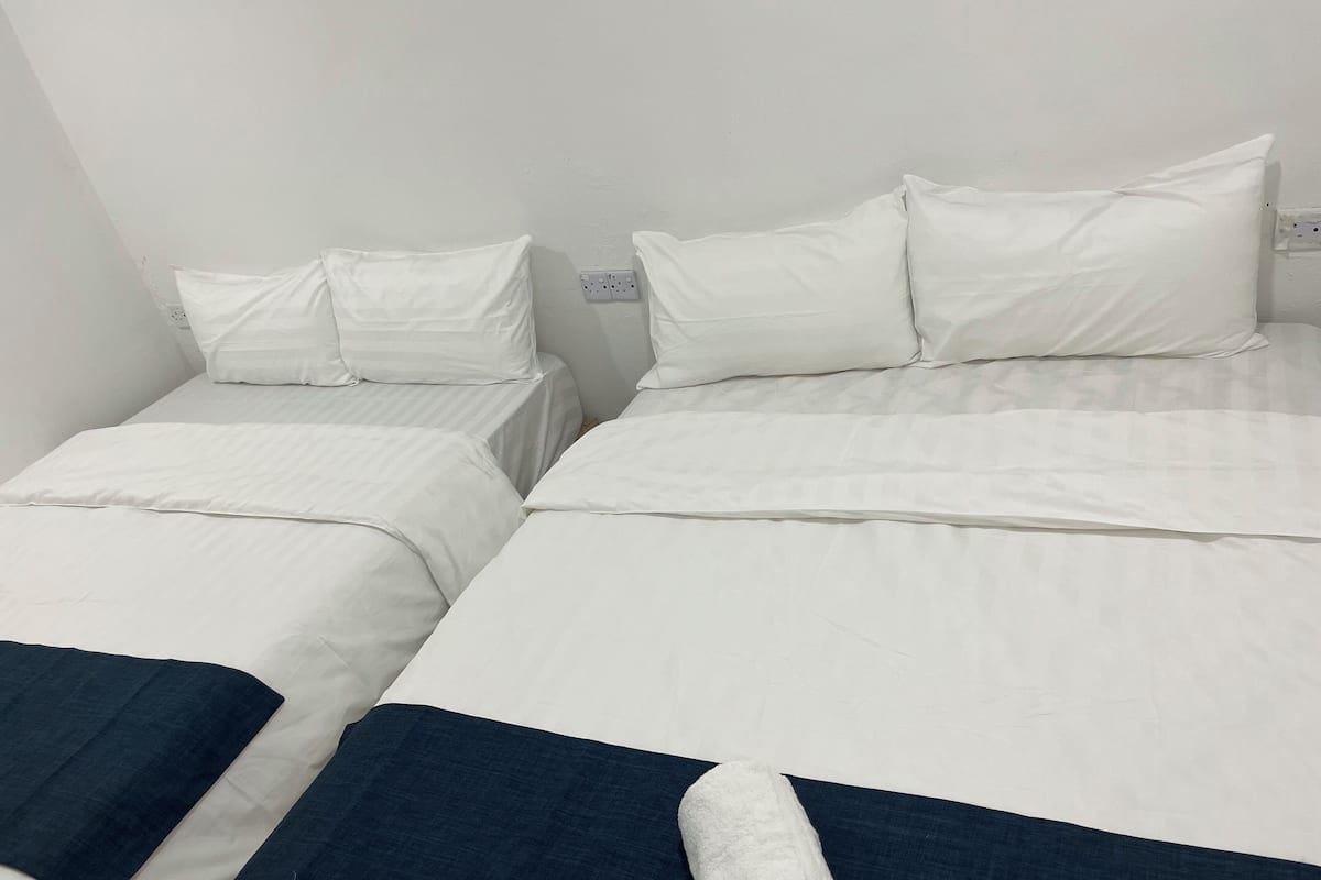 Family Quadruple Room | Soundproofing, iron/ironing board (on request), WiFi (free)