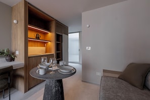 Suite estudio Deluxe | Área de sala de estar