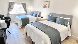A hotel room with two beds, a desk, a chair, a lamp, and a window with curtains. - 2071 | Upscale 2Q Suite Near Park City + Pool/Hot Tub (Midway)