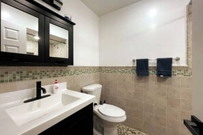 Shower, hair dryer, towels, soap