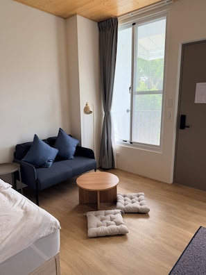 Basic Quadruple Room, Non Smoking | Living area