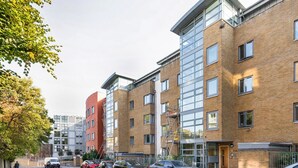 A modern apartment building with multiple floors, large windows, and a brick facade. - Blueground | Chalk Farm, terrace, nr Primrose Hill (London)