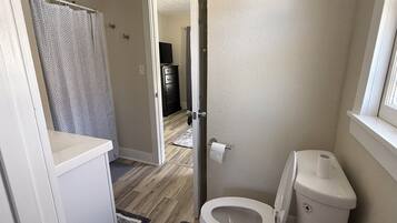 Shower, towels, soap, toilet paper