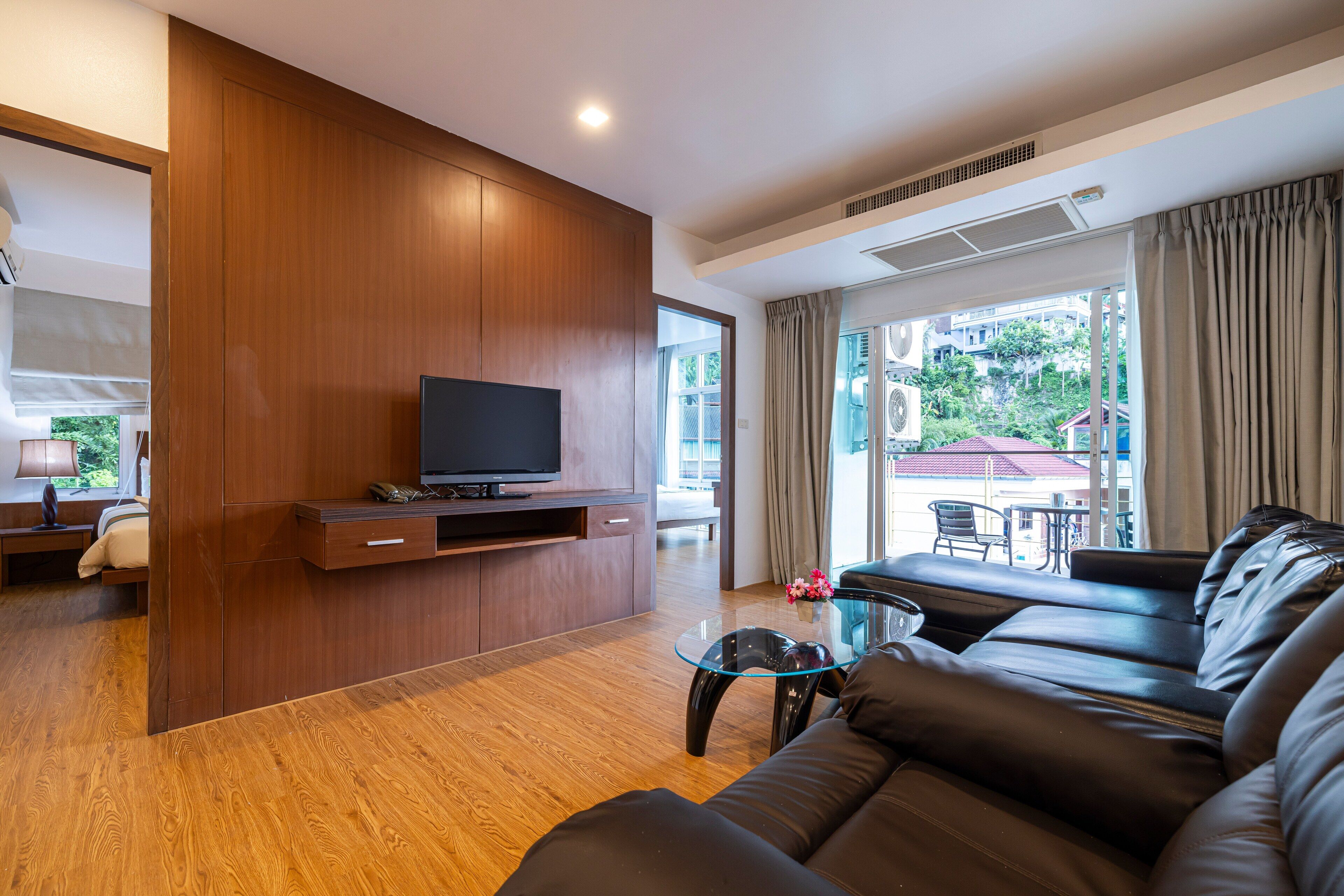 Premium Suite, 2 Bedrooms, Mountain View | Living area | 55-inch TV with cable channels, pay movies, streaming services