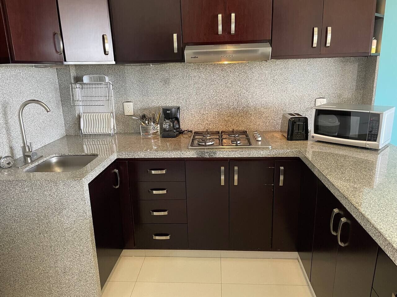 Fridge, microwave, stovetop, coffee/tea maker