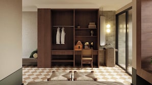 A modern bathroom with a large mirror, a wooden vanity, and a ceiling fan.