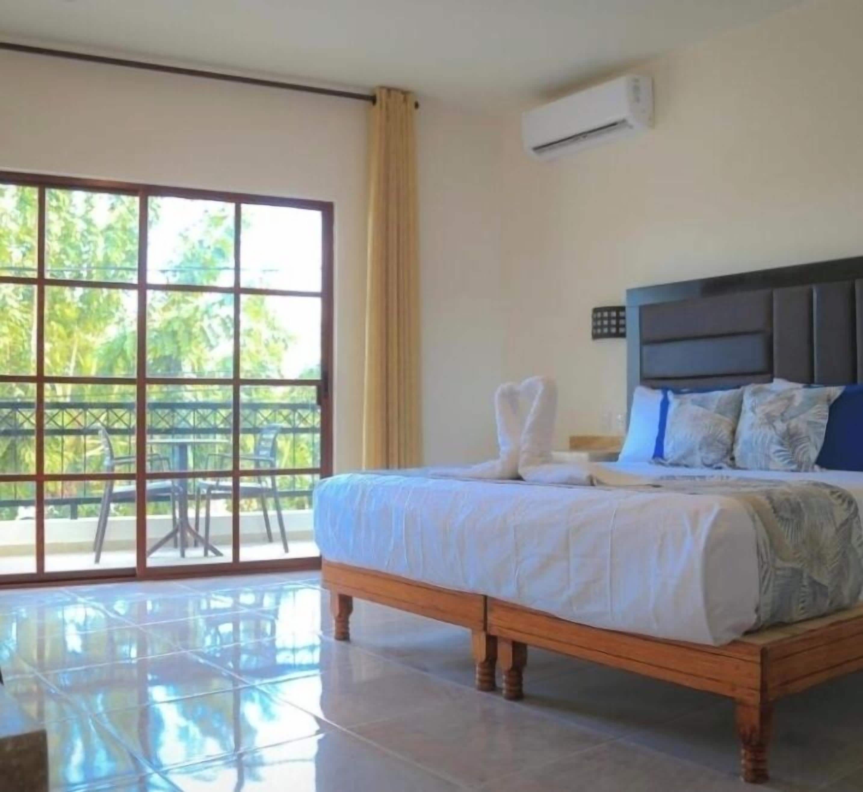Comfort Studio Suite, Lagoon View | In-room safe, desk, laptop workspace, blackout drapes