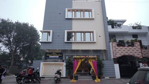 A modern hotel with a sign for "Hotel Royal Celebration" and "Room's & Banquet's". - Royal Celebration (Lucknow)