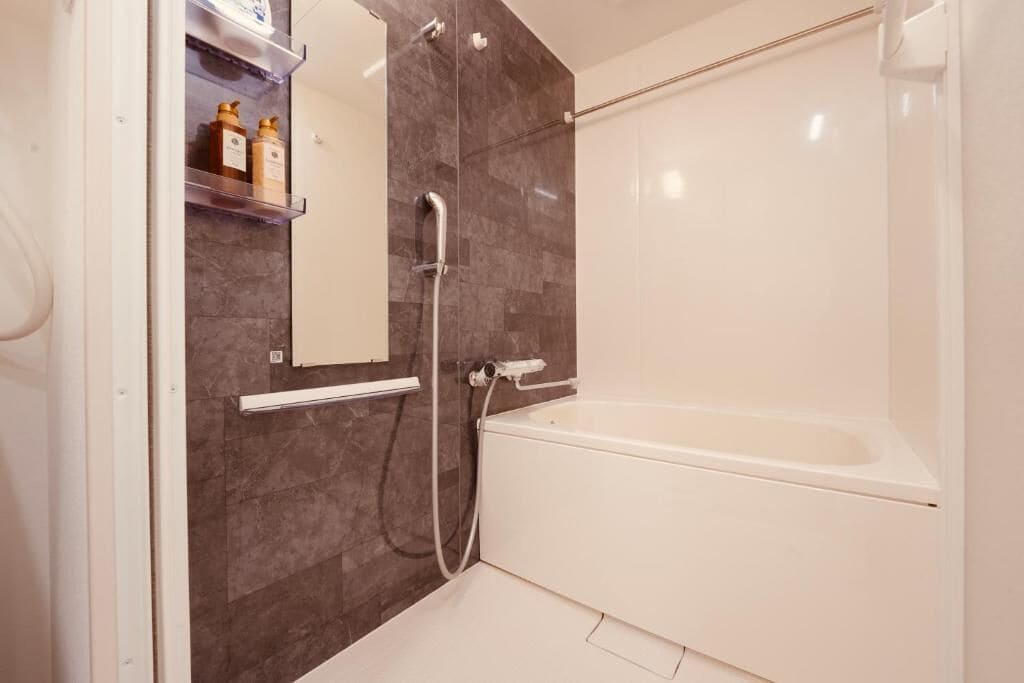 Separate tub and shower, free toiletries, hair dryer, slippers