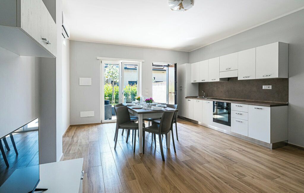 Apartment, Patio, Garden View | Private kitchen | Highchair, dining tables