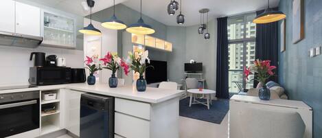 Deluxe Apartment, Partial Sea View | Living area | Computer monitors