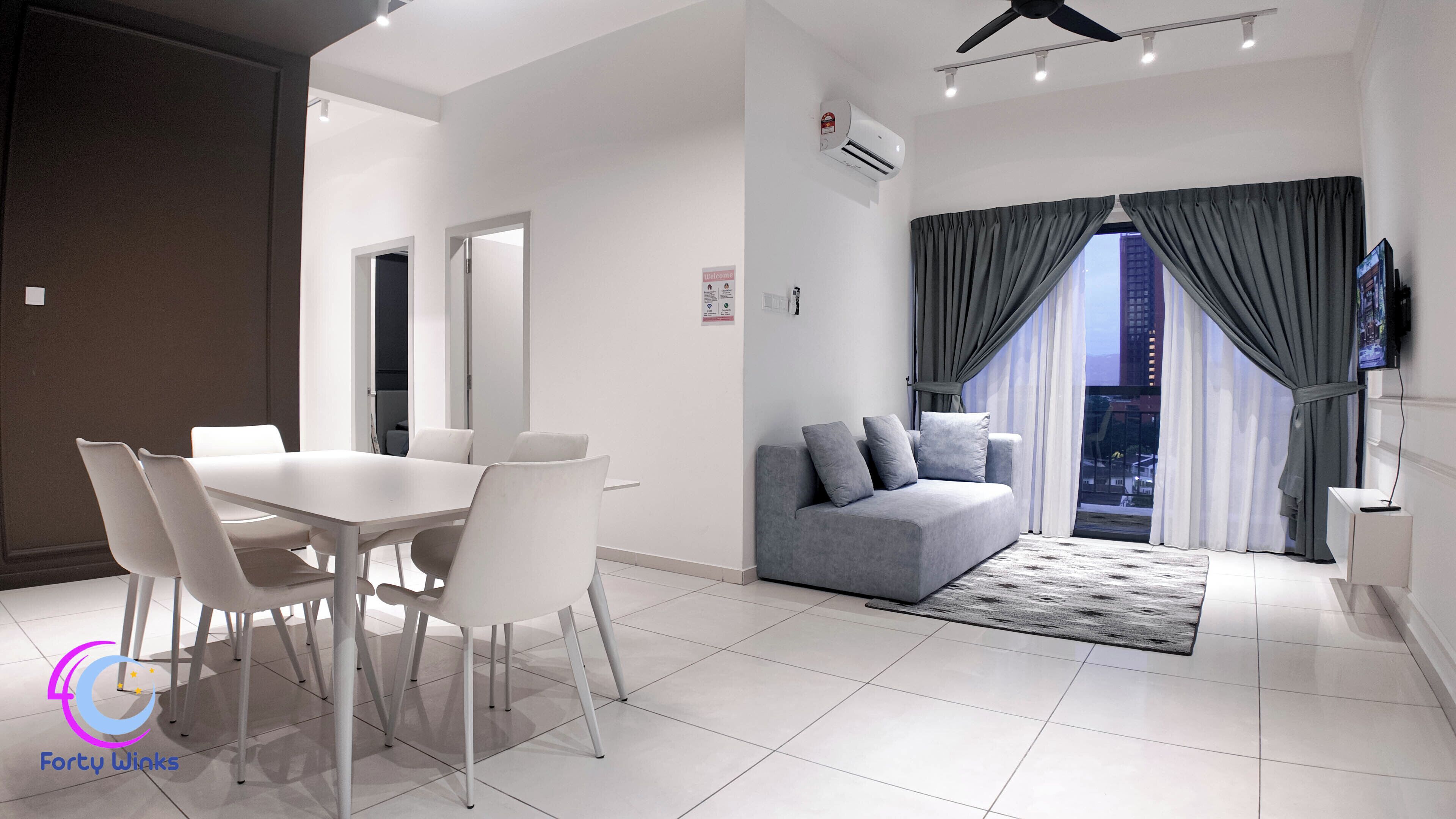 Basic Apartment, Balcony, City View | Living area | Flat-screen TV