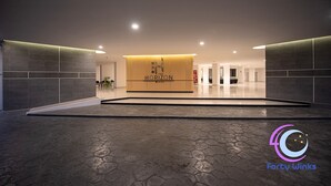 Una moderna hall d'albergo con una reception che riporta la scritta "HORIZON".