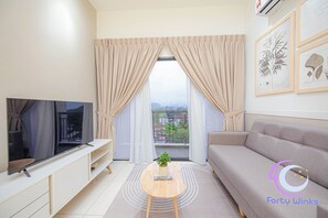 Appartement Majestueux, balcon, vue ville | Coin séjour