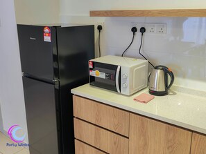 Grand Apartment, Balcony, City View | Private kitchenette | Fridge, microwave