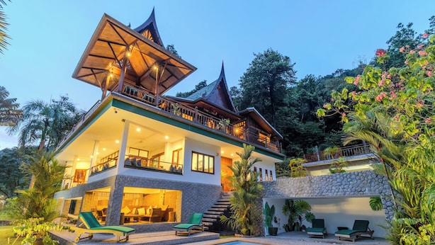 A two-story house with a pool, outdoor seating, and a staircase leading to the upper level. - 6BR Villa Huge Pool & Mountain View V89 (Rawai)