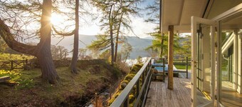 Luxury waterfall cottage with private hot tub at Loch Tay