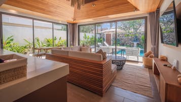 Deluxe Villa | Living area | 32-inch flat-screen TV with cable channels