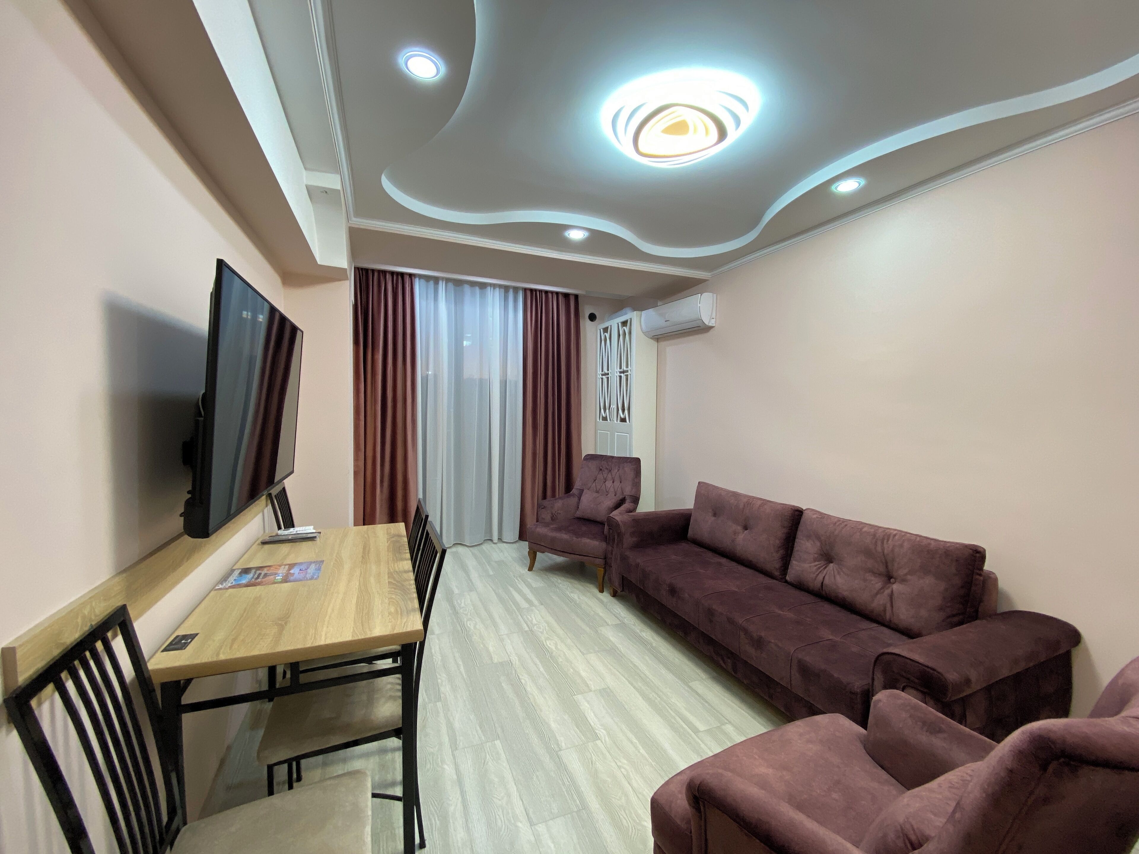Standard Apartment, Balcony | Living area | 50-inch flat-screen TV with cable channels