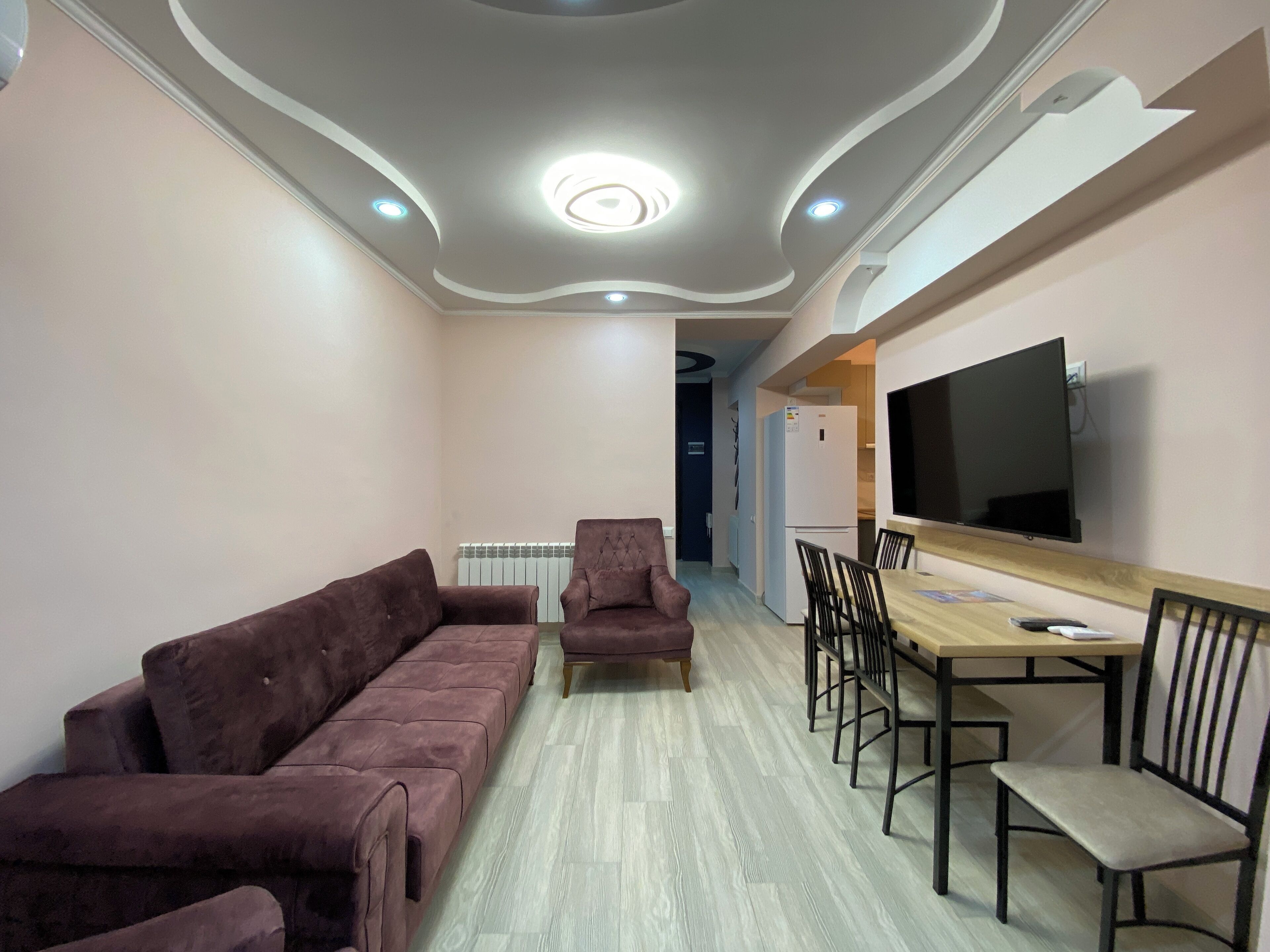 Standard Apartment, Balcony | Living area | 50-inch flat-screen TV with cable channels